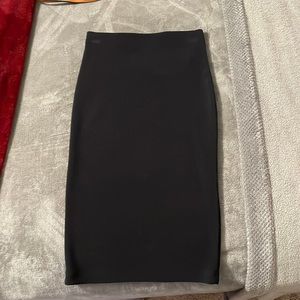 Black, polyester/spandex medium length pencil skirt. Never worn.
